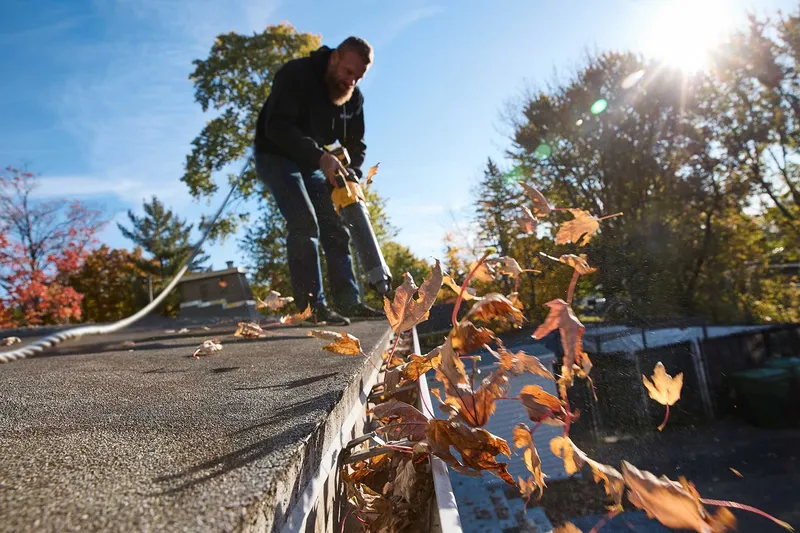 Gutter cleaning by DE Group, Inc.